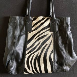 Genuine leather designer hand bag with zebra-printed cowhide stripe